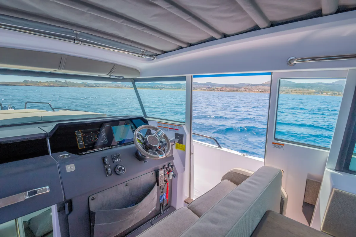 Cockpit of VIDA, a Axopar 37 XC Cross Cabin motorboat at Lavreotiki Municipal Unit, Greece