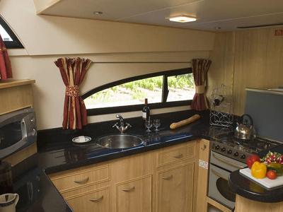 Galley of Royal Mystique A - Comfort Plus 17, a Cygnet Royal Mystique motorboat at Branges, France