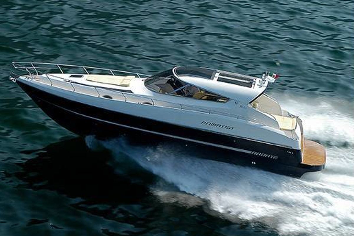Exterior view of Champagne Three, a Primatist G 46 motorboat at Cannigione, Italy