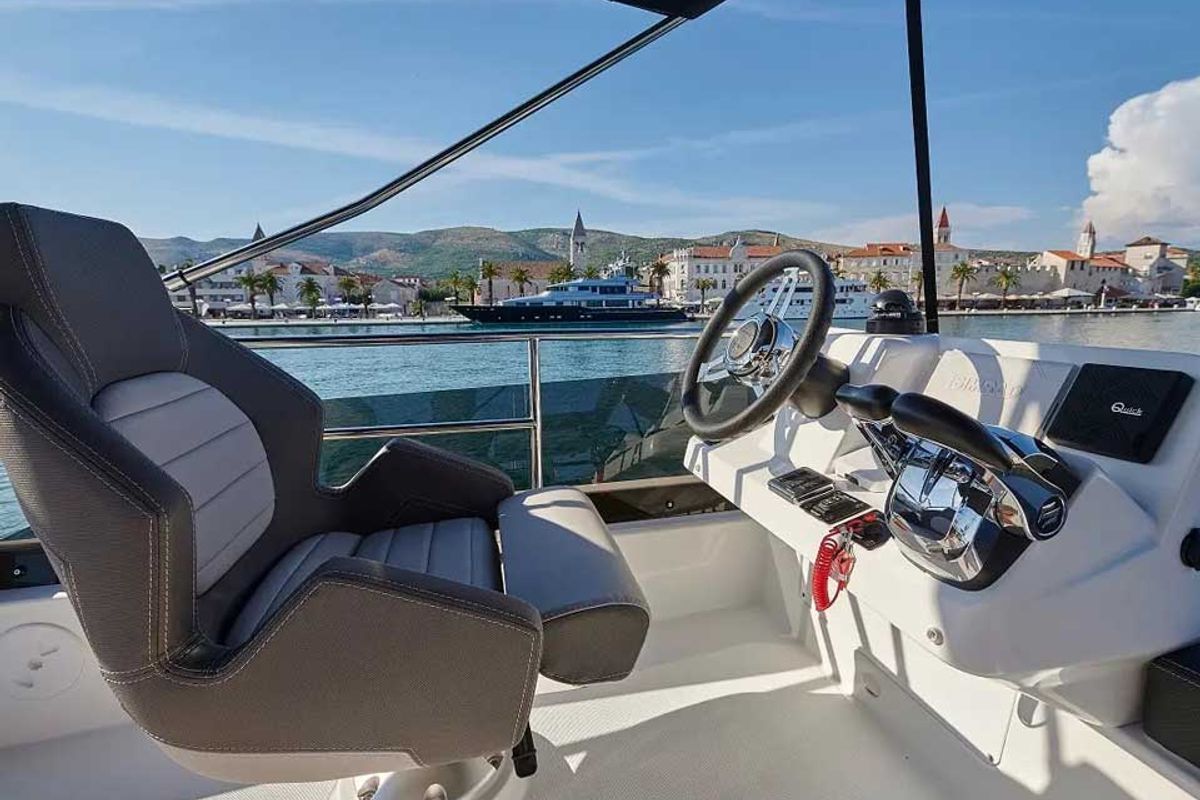Cockpit of Merry Fisher 1095 Fly, a Jeanneau Merry Fisher 1095 Fly motorboat at Grad Trogir, Croatia