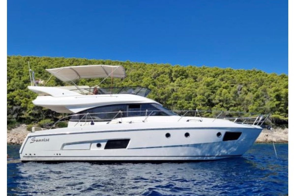 Exterior view of Sunrise, a Bavaria Virtess 420 Fly motorboat at Grad Trogir, Croatia