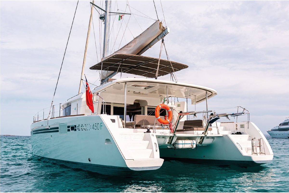 Exterior view of Lluna, a Lagoon 450 catamaran at Sant Antoni de Portmany, Spain