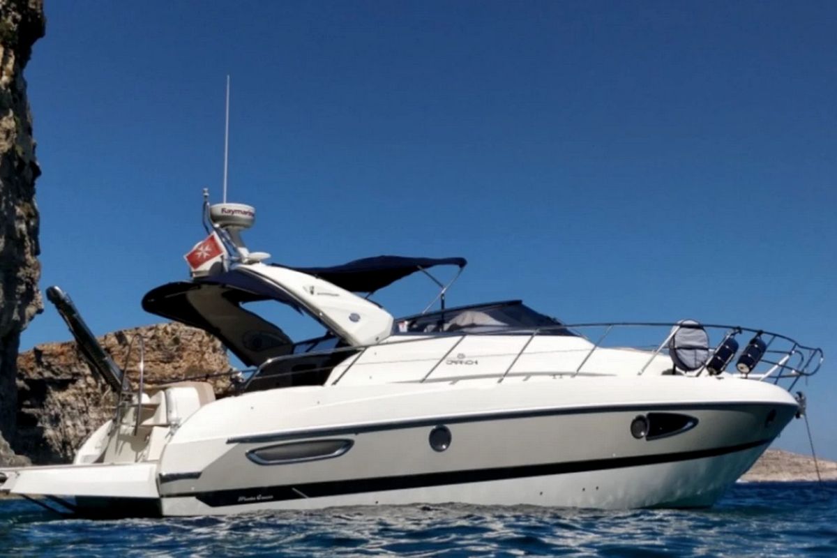 Exterior view of Tottoi, a Cranchi Zaffiro 36 motorboat at Cannigione, Italy