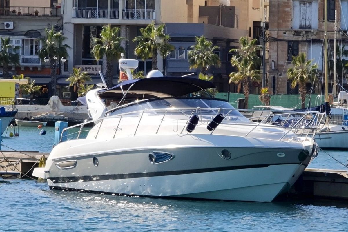Exterior view of Tottoi, a Cranchi Zaffiro 36 motorboat at Cannigione, Italy