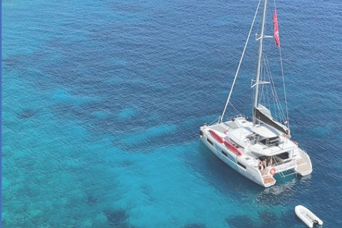Exterior view of Blue Regeneration, a Lagoon 46 catamaran at Sant Antoni de Portmany, Spain
