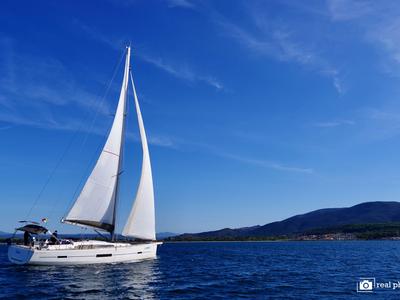 Exterior view of Stella, a Dufour 520 Grand Large sailboat at Puntone di Scarlino, Italy