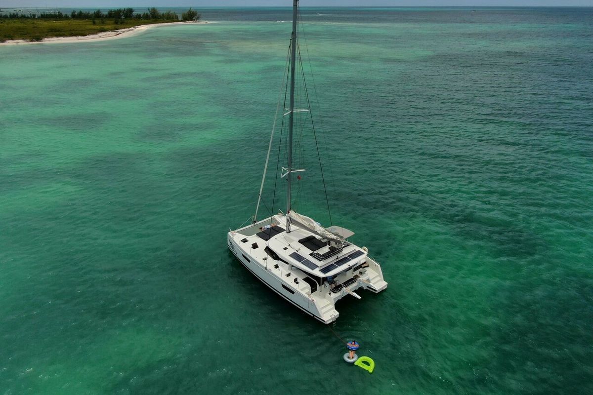 Exterior view of Three Sheets, a Fountaine Pajot Saona 47 Quintet catamaran at Road Town, British Virgin Islands