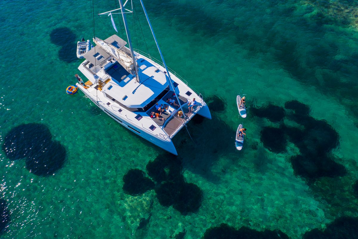 Exterior view of Caipirinha , a Dufour Catamaran 48 catamaran at Mykonos, Greece