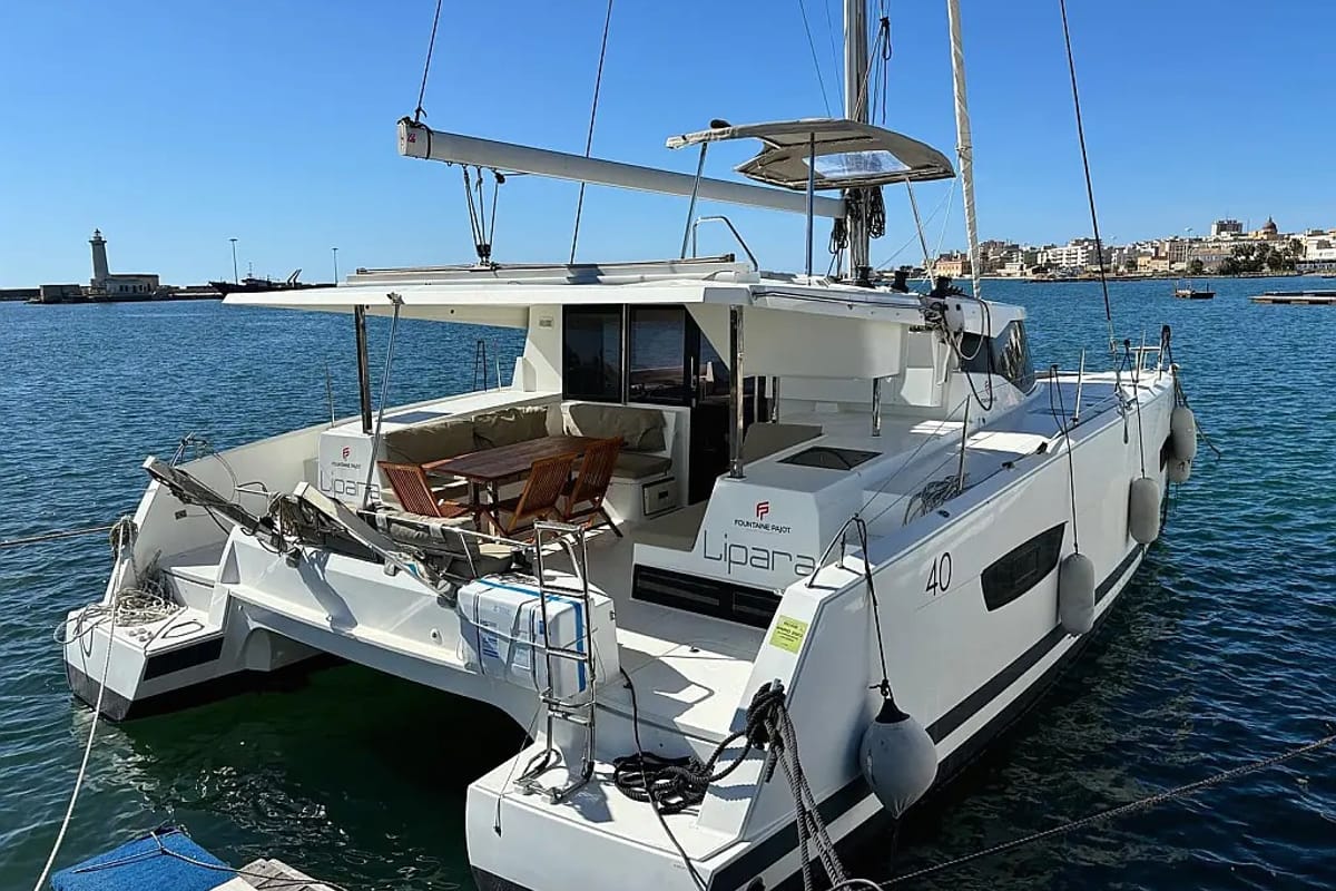 Exterior view of LIPARA, a Fountaine Pajot Lucia 40 catamaran at U Pàize/Carloforte, Italy