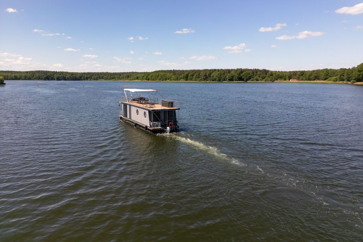 Exterior view of RedWine, a Woma D13 motorboat at Fürstenberg/Havel, Germany