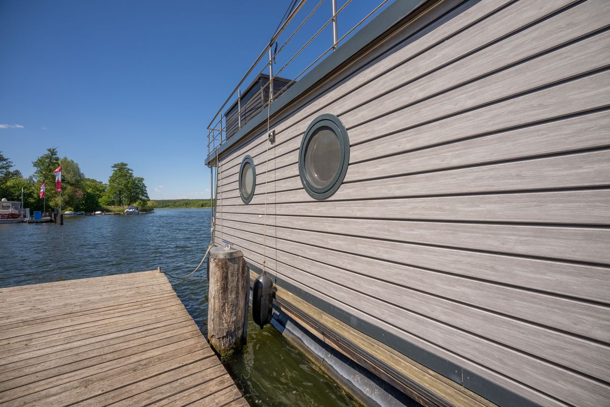 Exterior view of RedWine, a Woma D13 motorboat at Fürstenberg/Havel, Germany