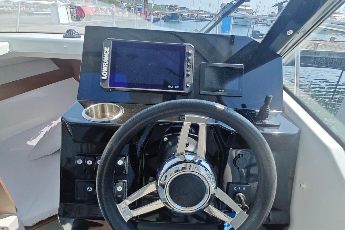 Cockpit of Ares, a Jeanneau Merry Fisher 795 Series 2 motorboat at Punat, Croatia