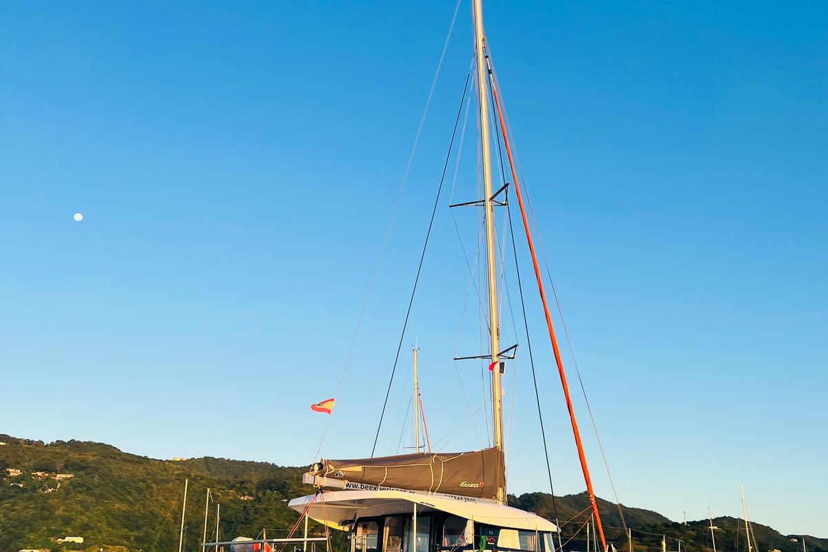 Exterior view of Olokum Ibiza Crewed, a Excess 11 catamaran at Ibiza, Spain