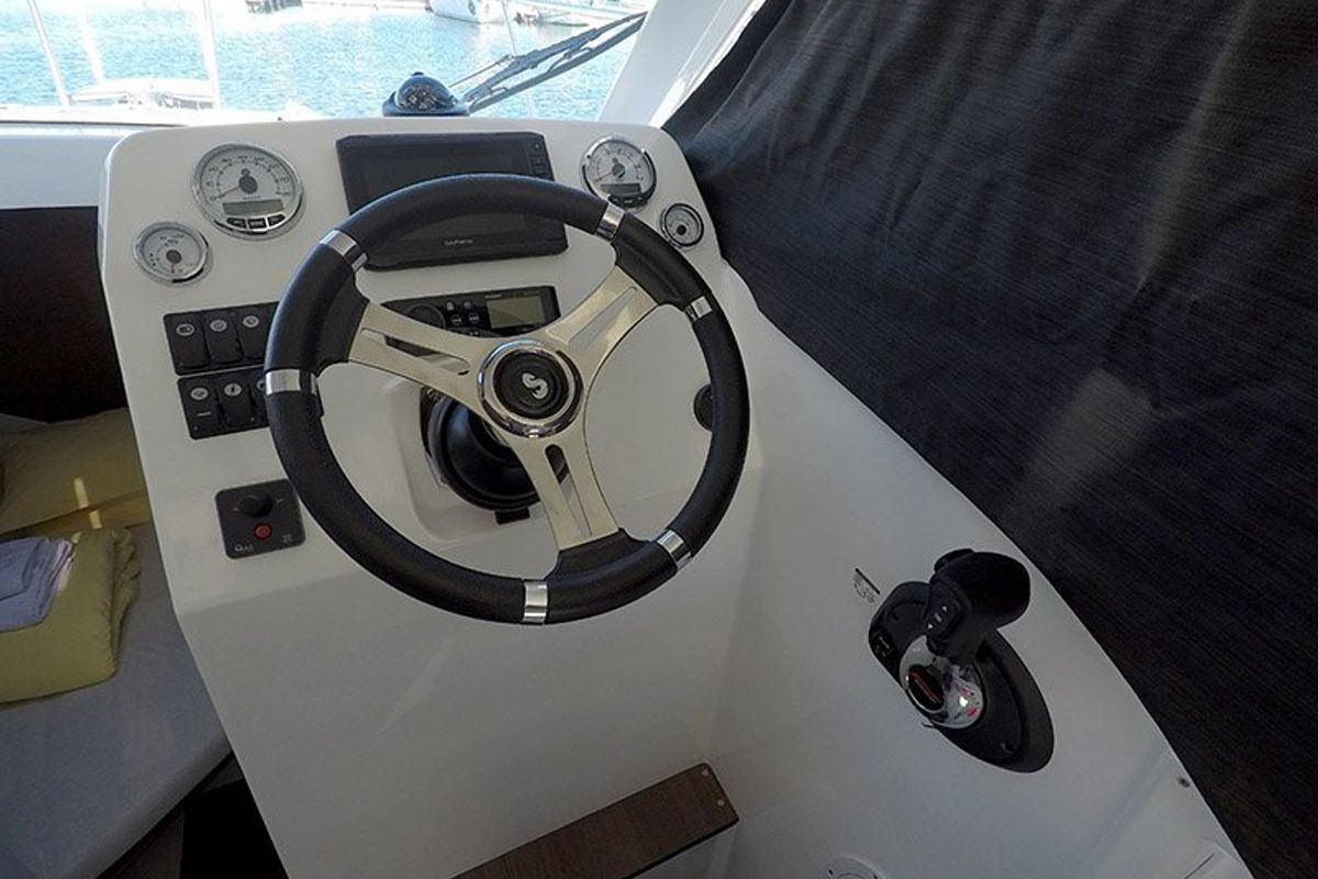 Cockpit of Lovre, a Beneteau Antares 8 OB motorboat at Grad Šibenik, Croatia