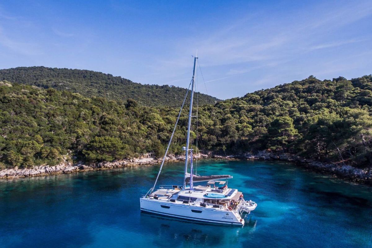 Exterior view of Princess Aphrodite, a Fountaine Pajot Saba 50 catamaran at Grad Trogir, Croatia
