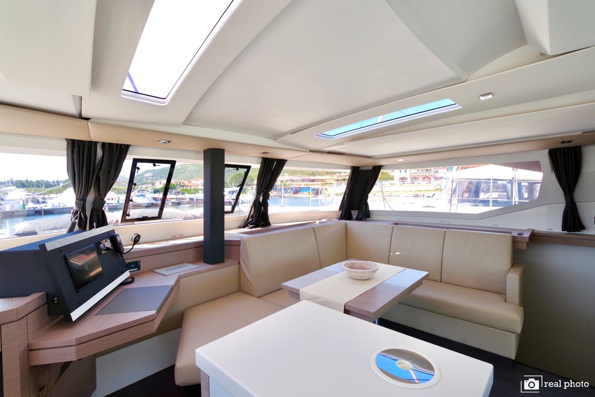 Salon of Orsa 3, a Fountaine Pajot Saona 47 Quintet catamaran at Cannigione, Italy