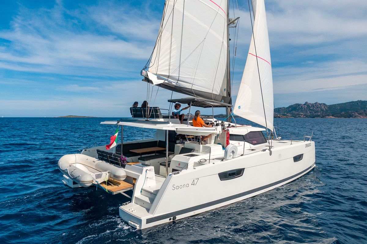Exterior view of Orsa 3, a Fountaine Pajot Saona 47 Quintet catamaran at Cannigione, Italy