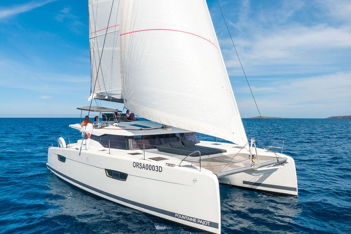 Exterior view of Orsa 3, a Fountaine Pajot Saona 47 Quintet catamaran at Cannigione, Italy