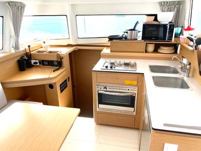 Galley of OLOKUM Mallorca BAREBOAT, a Excess 11 catamaran at Port d'Andratx, Spain