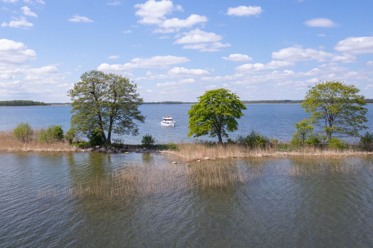 Exterior view of Sirina, a Northman 1200 motorboat at Sztynort, Poland