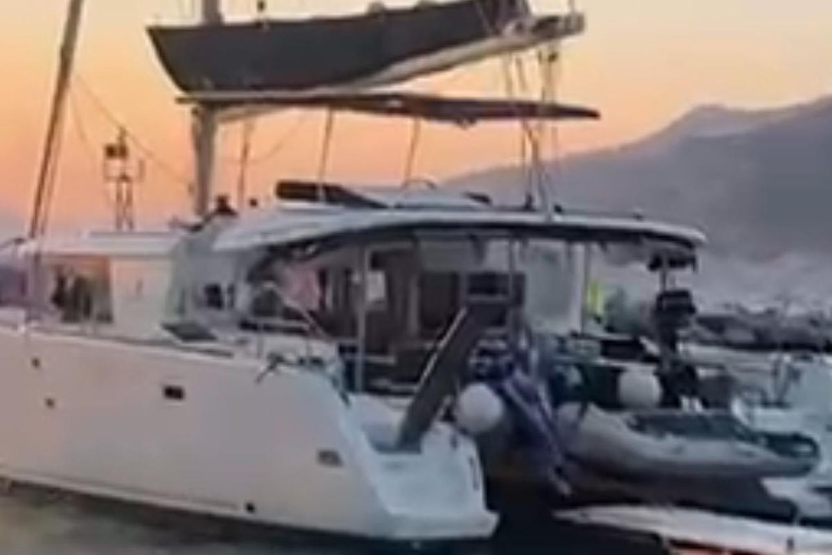 Exterior view of Martina Tres, a Lagoon 450 Fly catamaran at Sant Antoni de Portmany, Spain