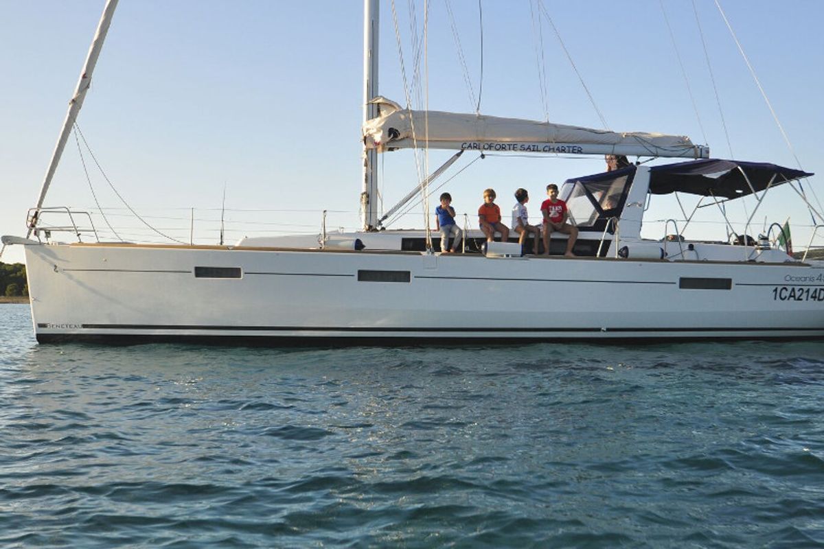 Exterior view of JN, a Beneteau Oceanis 45 sailboat at U Pàize/Carloforte, Italy