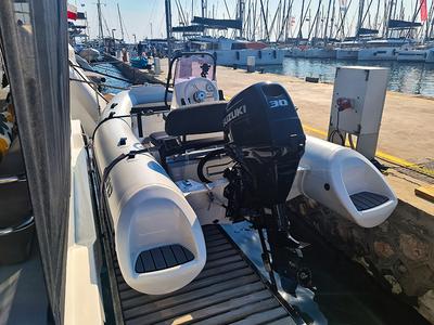 Breezer, a Fountaine Pajot Aura 51 catamaran at Agios Stefanos, Greece