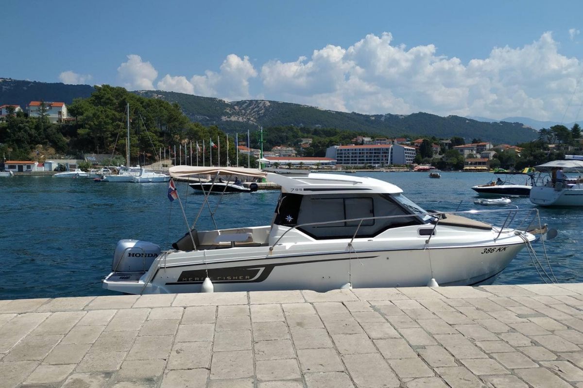 Exterior view of MF 795, a Jeanneau Merry Fisher 795 motorboat at Punat, Croatia
