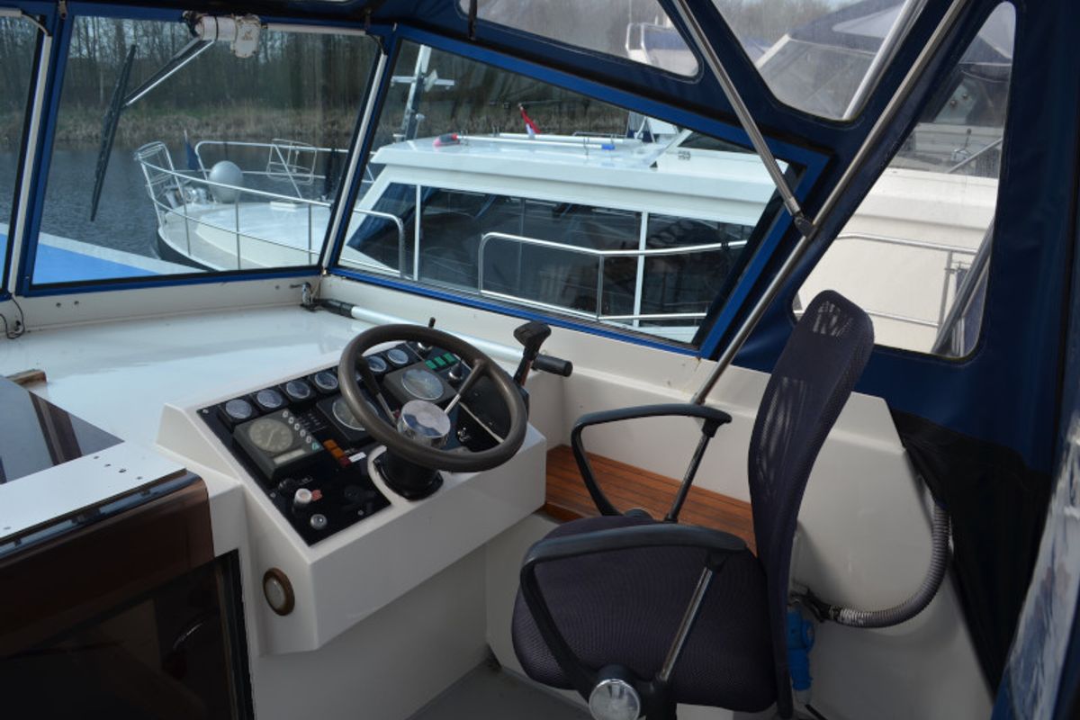 Cockpit of Holidaytime, a De Drait Safari Houseboat 1200 motorboat at Drachten, Netherlands