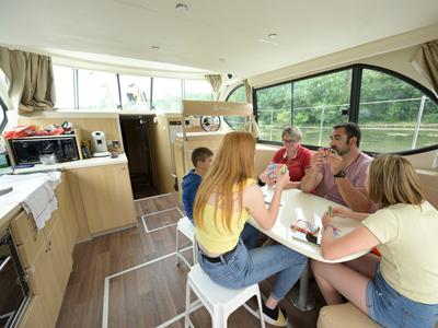 Salon of Orchestra, a Nicols Octo Fly 12 motorboat at Grez-Neuville, France