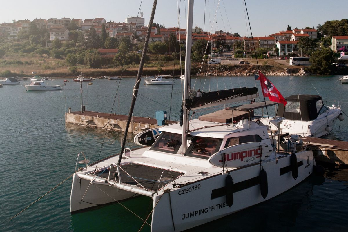 Exterior view of Jumping Fitness, a Aventura Catamarans Aventura 34 catamaran at Grad Šibenik, Croatia