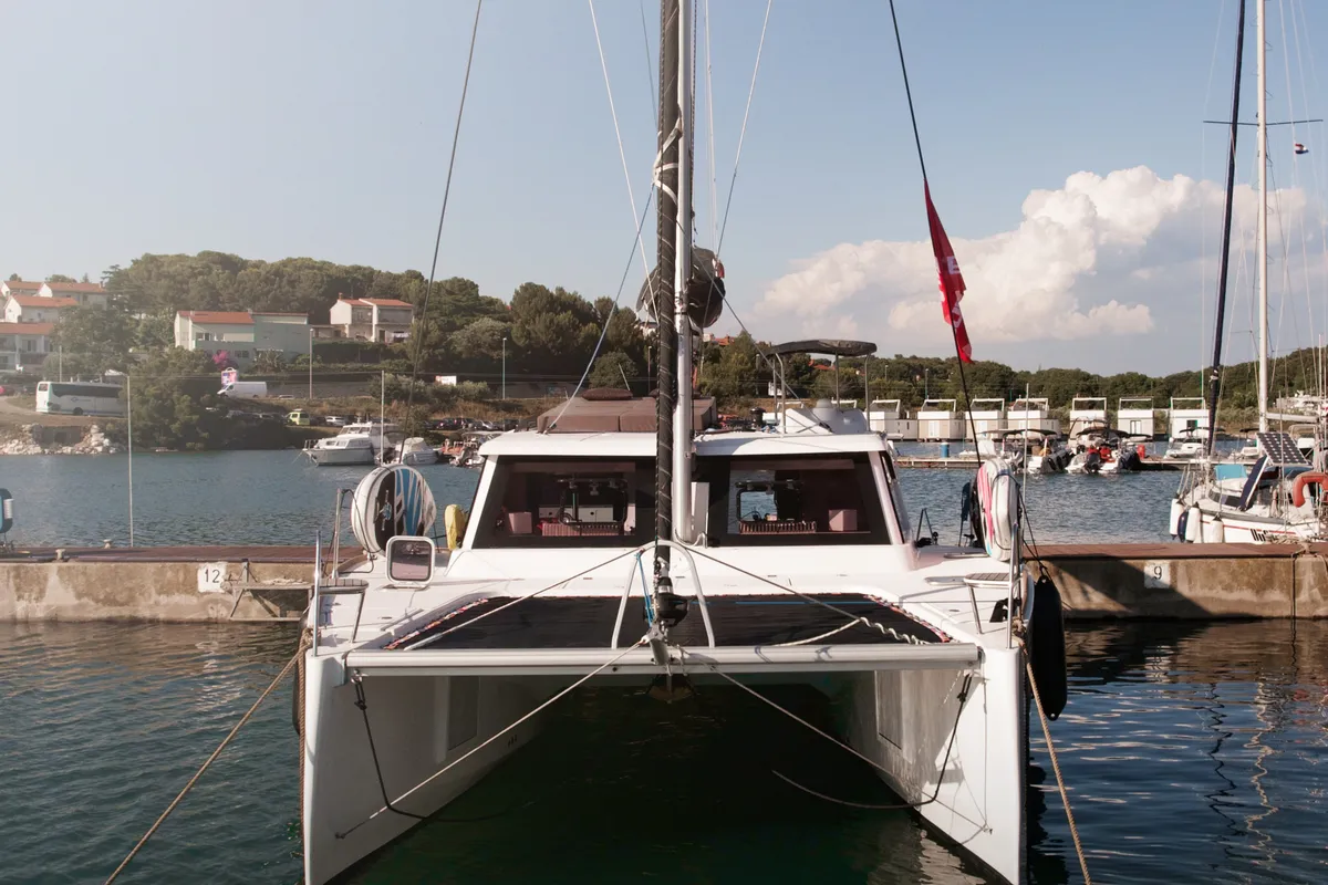 Exterior view of Jumping Fitness, a Aventura Catamarans Aventura 34 catamaran at Grad Šibenik, Croatia