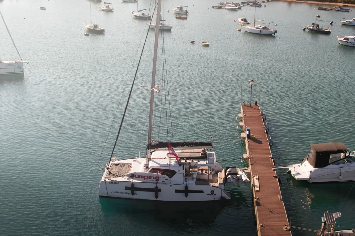 Exterior view of Jumping Fitness, a Aventura Catamarans Aventura 34 catamaran at Grad Šibenik, Croatia