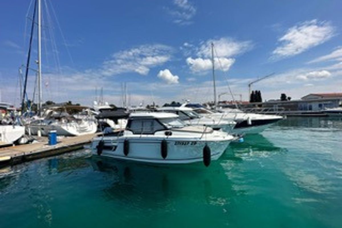 Exterior view of Klapa, a Jeanneau Merry Fisher 795 motorboat at Municipality of Novigrad, Croatia