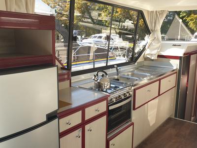 Galley of Harlingen, a Nicols Sedan 1160 motorboat at Lübz, Germany