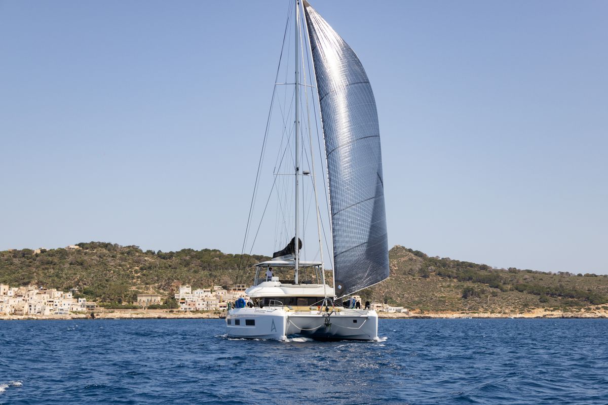 Exterior view of CARA, a Lagoon 55 catamaran at Capo d'Orlando, Italy