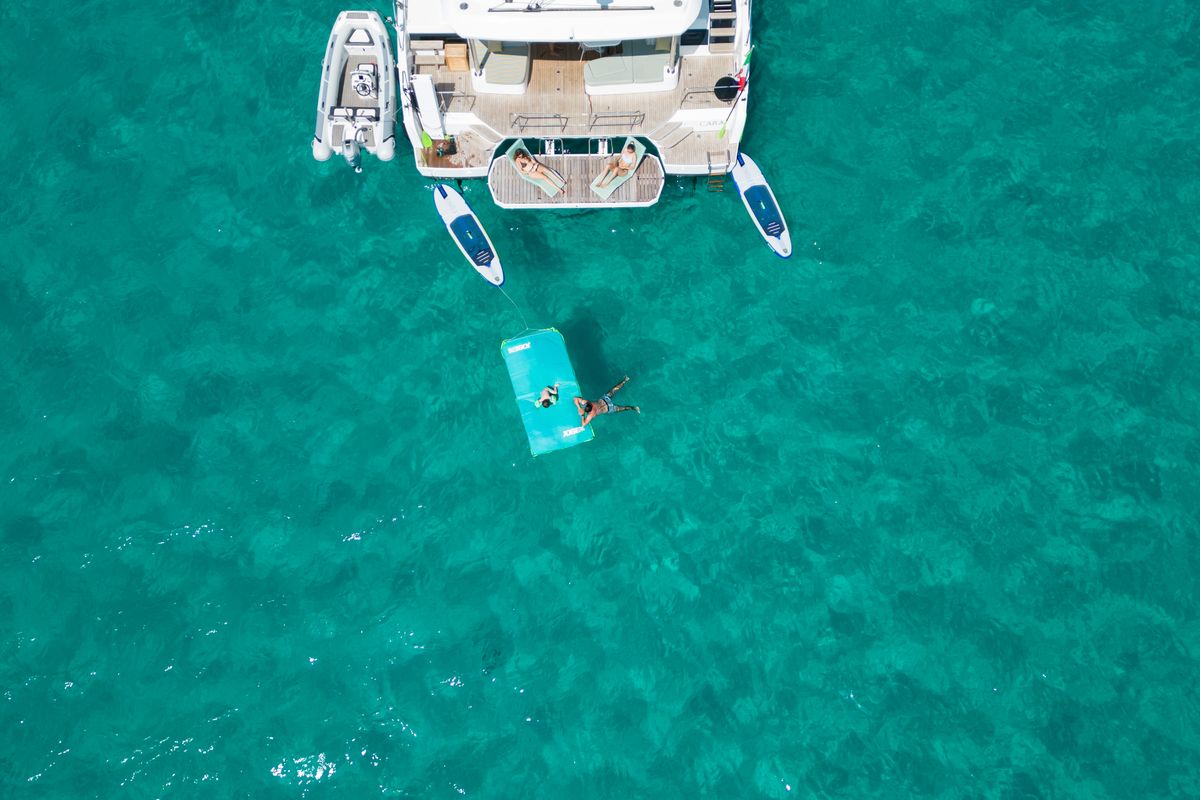 Exterior view of CARA, a Lagoon 55 catamaran at Capo d'Orlando, Italy