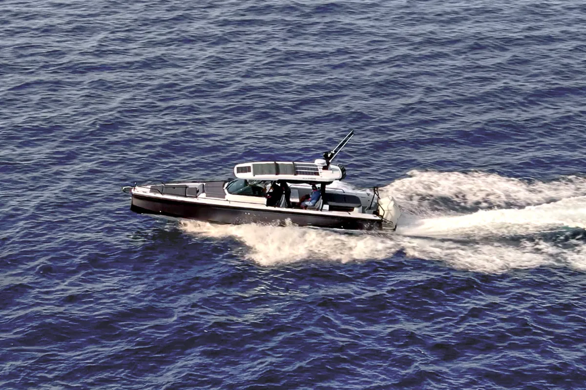 Exterior view of ENIGMA, a Axopar 37  Sun Top motorboat at Parikia, Greece