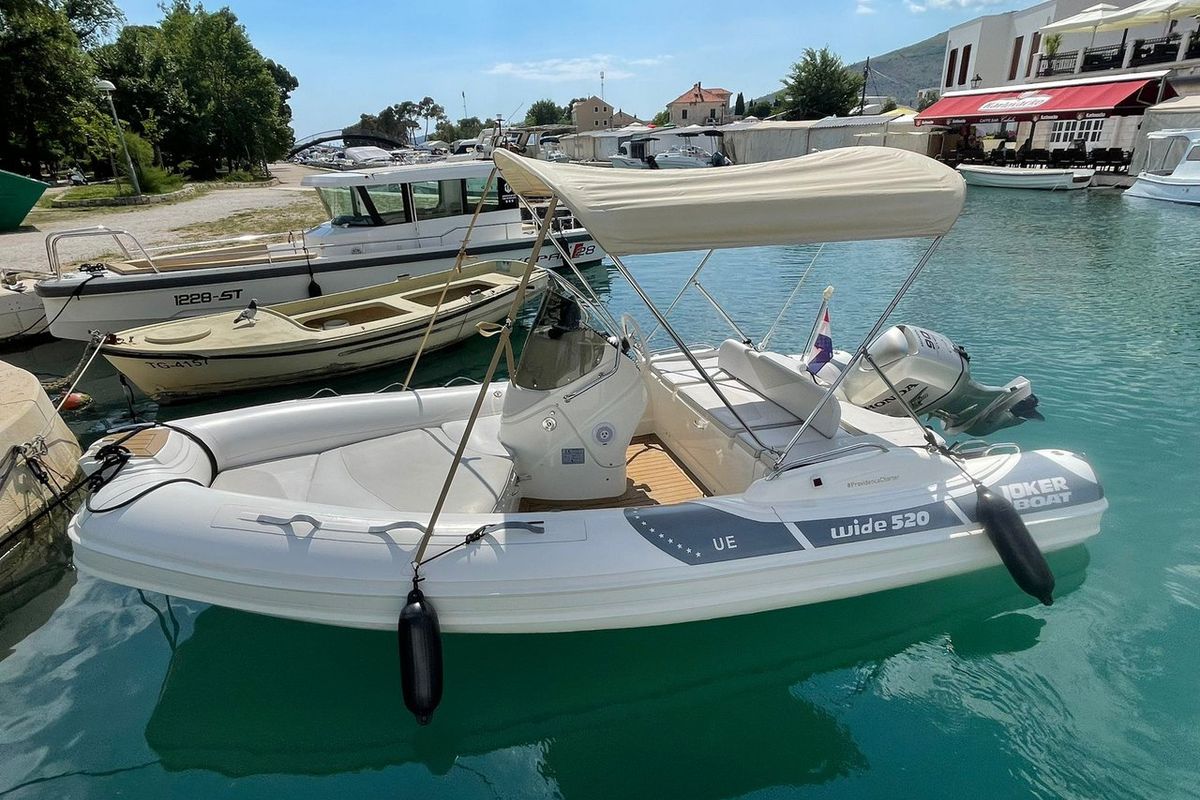 Exterior view of JokerBoat Wilde, a Jokerboat Wide 520 rib at Grad Trogir, Croatia