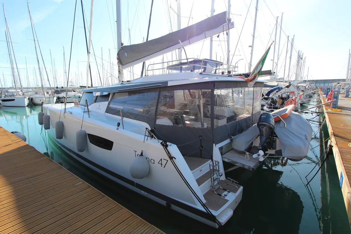 Exterior view of Sonrisa, a Fountaine Pajot Tanna 47 Maestro catamaran at Olbia, Italy