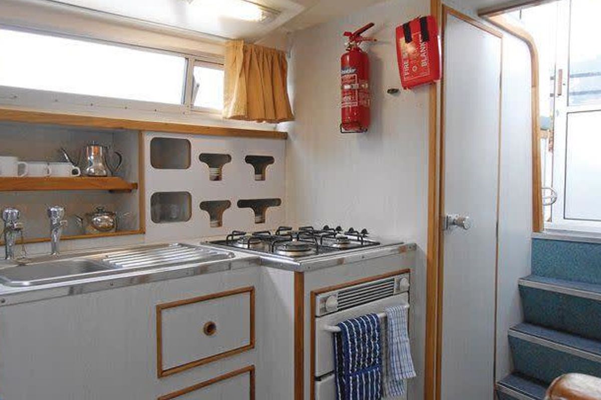 Galley of Kingfisher WHS - Budget 1, a Cygnet Kingfisher WHS motorboat at Laggan, United Kingdom