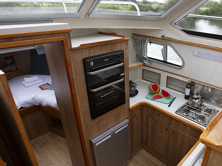 Galley of Crusader - Budget 19, a Cygnet Crusader motorboat at Rheinsberg, Germany