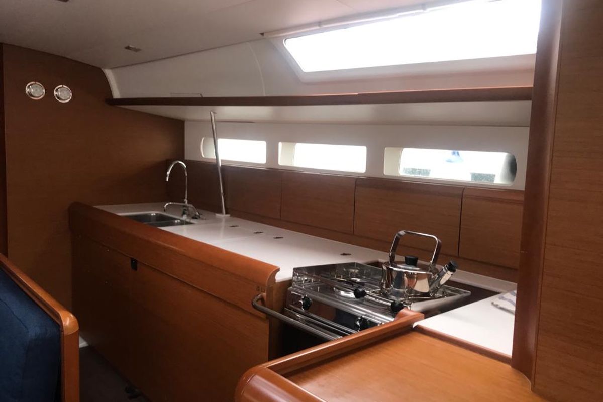 Galley of Alboran Grappa, a Jeanneau Sun Odyssey 519 sailboat at es Jonquet, Spain