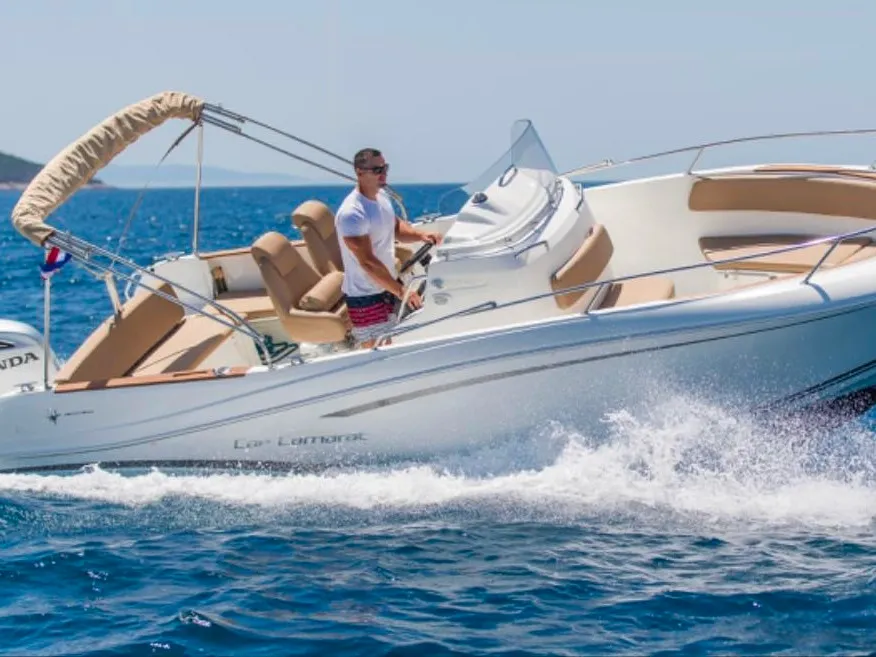 Exterior view of Cap Camarat, a Jeanneau Cap Camarat 7.5 CC motorboat at Grad Trogir, Croatia