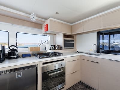 Galley of Adel, a Lagoon 55 catamaran at Lavreotiki Municipal Unit, Greece