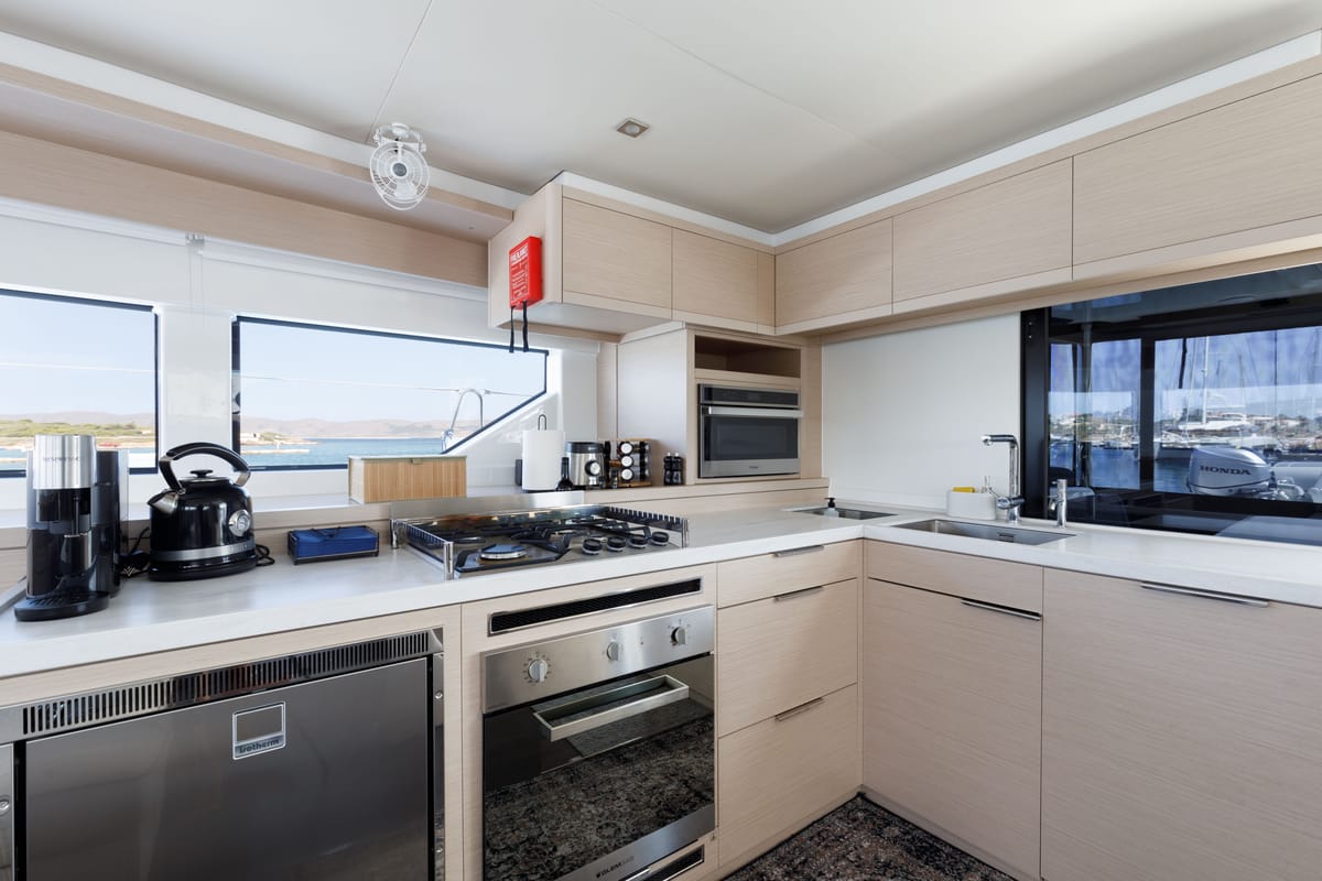 Galley of Adel, a Lagoon 55 catamaran at Lavreotiki Municipal Unit, Greece