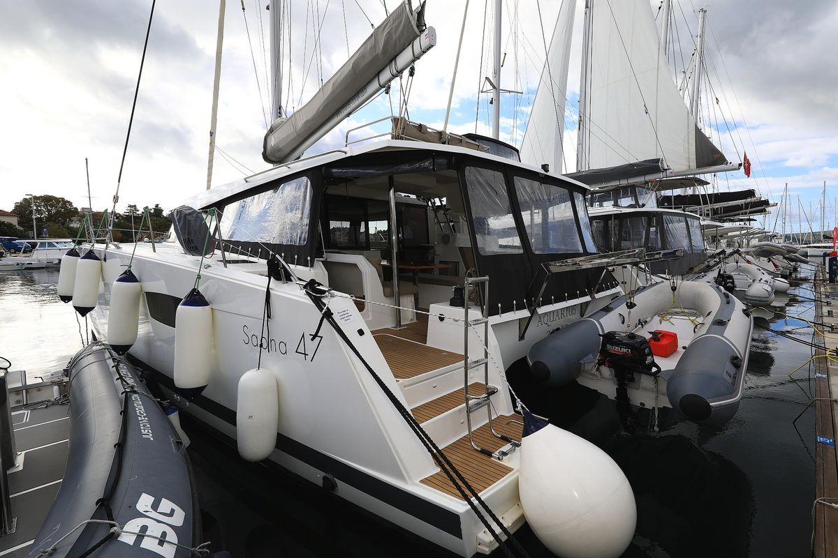 Exterior view of Aquarius, a Fountaine Pajot Saona 47 Quintet catamaran at Grad Biograd na Moru, Croatia