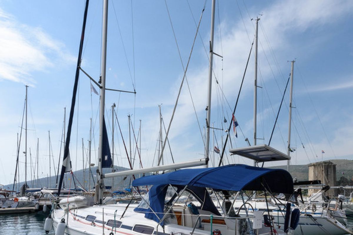 Exterior view of Dišpet, a Bavaria 33 Cruiser sailboat at Grad Trogir, Croatia