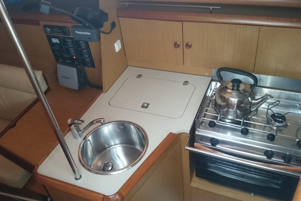 Galley of Regina IV, a Jeanneau Sun Odyssey 32i sailboat at Lavreotiki Municipal Unit, Greece