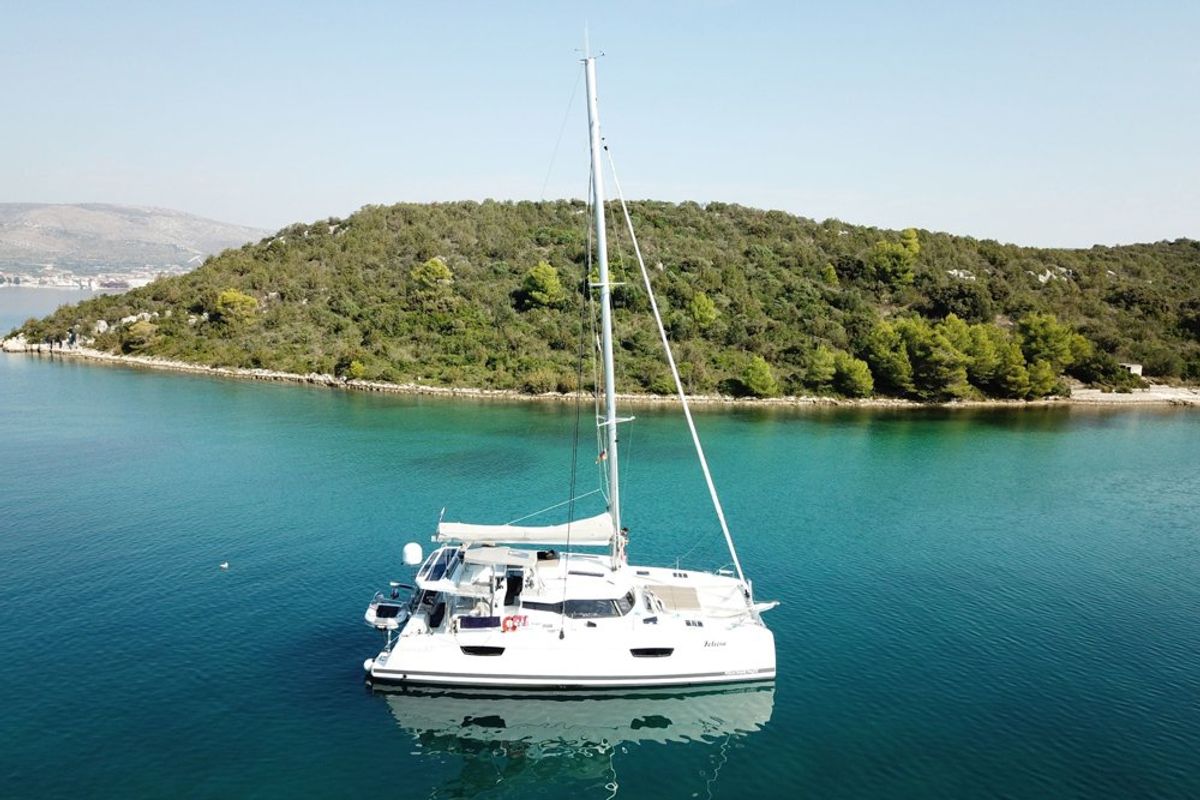 Exterior view of Felicia, a Fountaine Pajot Saona 47 Quintet catamaran at Općina Rogoznica, Croatia